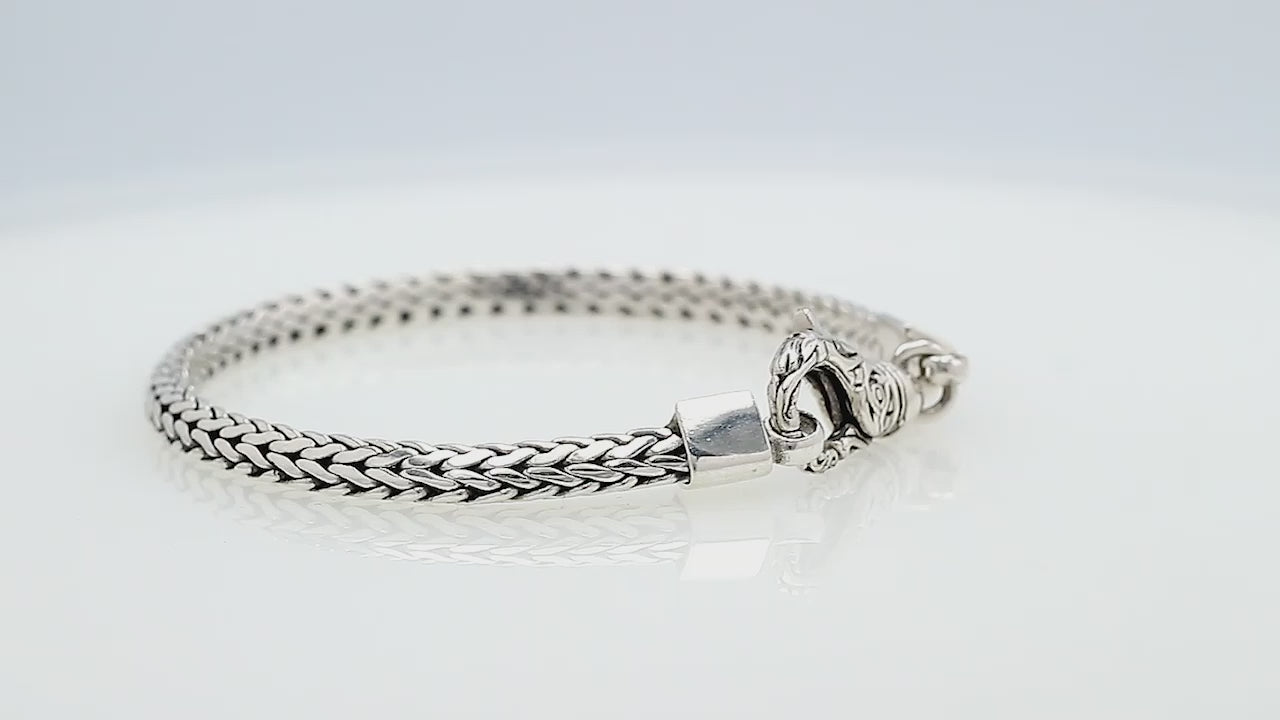 Wholesale sterling silver bracelet featuring a polished 4MM Balinese woven chain with subtle oxidized details and a secure lobster lock for catalog and bulk listings.