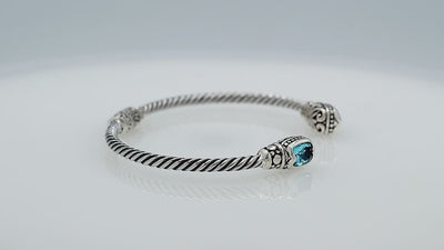 Silver twisted cable bangle in 925 sterling silver with Amethyst Quartz ends and Balinese engraving.