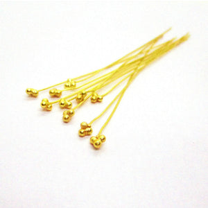 Long 18K gold overlay copper head pin with granulated tri-bead top.