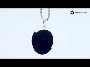 Sterling silver round pendant with vibrant abalone shell inlay and artistic silver overlay, handcrafted Bali jewelry available for wholesale purchase.