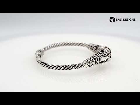 Sterling silver twisted bangle with pearl ends and oxidized Balinese design