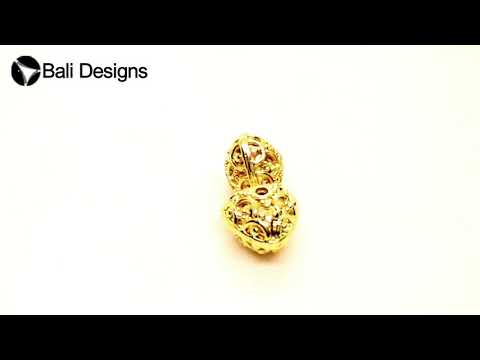 Handcrafted triangular-round filigree bead with 18K gold overlay over copper, made in India for wholesale jewelry production.