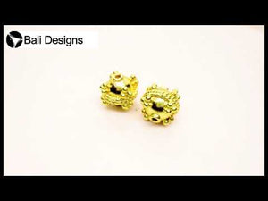 Handcrafted round spacer bead with granulated dots and rope border, made with 18K gold overlay over copper in India for wholesale jewelry production.