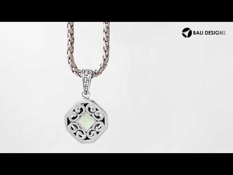 A handcrafted sterling silver pendant featuring a faceted Green Amethyst Quartz in a geometric Greek key frame, showcasing intricate Balinese silver artistry.