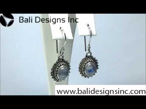 Wholesale sterling silver Bali granulated earrings featuring oval rainbow moonstone cabochons with polished–oxidized detailing, crafted to elevate artisan-inspired wholesale jewelry assortments with traditional handcrafted beauty.