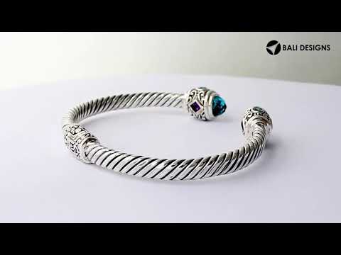 Sterling silver twisted bangle with Amethyst Quartz and Blue Topaz Quartz handcrafted in Bali.