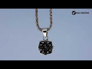 Square silver pendant with gold and diamond ornamental accents