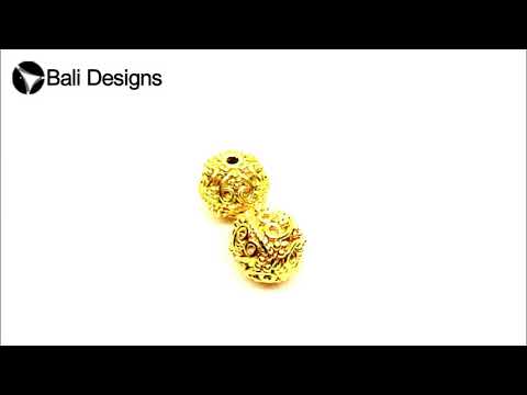 Handcrafted round filigree bead with 18K gold overlay over copper for wholesale jewelry making.