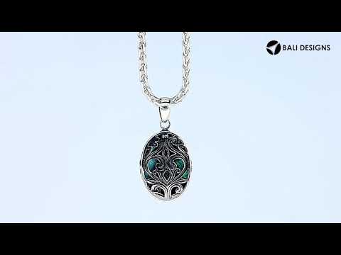 Handcrafted 925 Sterling Silver Abalone Shell oval pendant featuring detailed floral center design, high-gloss mirror finish, and Balinese-inspired craftsmanship for wholesale jewelry catalogs.