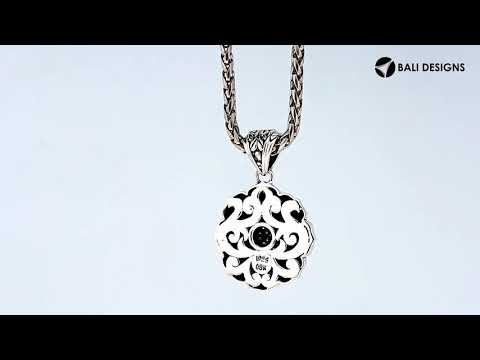 A wholesale sterling silver and 18K gold floral sunburst pendant featuring a diamond-studded center, intricate Balinese motifs, and oxidized two-tone detailing ideal for bulk jewelry orders.