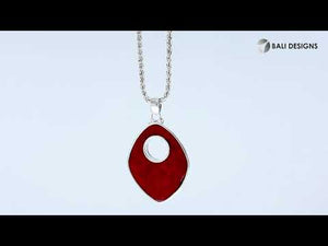 Sterling Silver Shield-Shaped Pendant Featuring Red Coral With Sunburst Medallion.