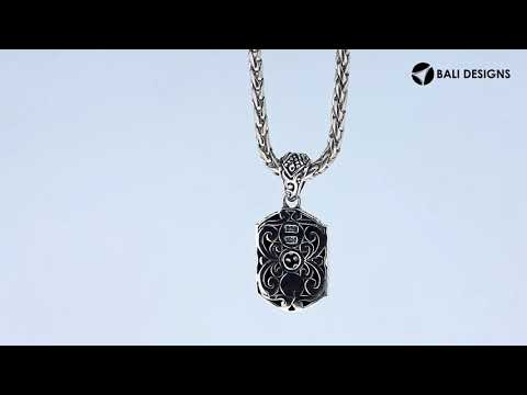 A wholesale-focused two-tone pendant made with sterling silver and 18K gold, featuring diamond accents, intricate sunburst motifs, and detailed Balinese craftsmanship suitable for bulk jewelry purchasing.