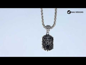 A wholesale-focused two-tone pendant made with sterling silver and 18K gold, featuring diamond accents, intricate sunburst motifs, and detailed Balinese craftsmanship suitable for bulk jewelry purchasing.