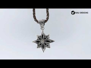 A handcrafted sterling silver compass star pendant featuring detailed Balinese tribal engraving and polished silver craftsmanship.