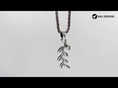 A handcrafted sterling silver leaf vine pendant featuring smooth organic detailing and a mirror-polished Balinese finish.