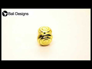 Handcrafted brushed spiral-pattern coin bead with 18K gold overlay over copper, made in India for wholesale jewelry manufacturers