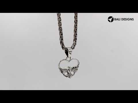 A handcrafted sterling silver heart and dove pendant featuring a minimalist design and a mirror-polished finish with Balinese artistry.