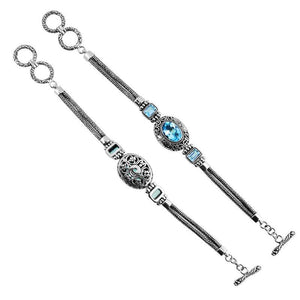 Sterling Silver Bracelet With Blue Topaz Quartz Stones In Oval And Emerald-Cut Shapes With Ornate Scrollwork And Woven Links