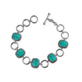 Sterling Silver Bracelet With Cushion Turquoise Shell Accents In Rope Bezels And Large Silver Rings