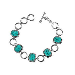 Sterling Silver Bracelet With Cushion Turquoise Shell Accents In Rope Bezels And Large Silver Rings
