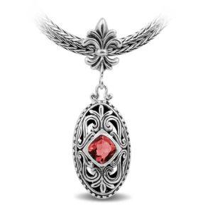 Sterling Silver Ornate Oval Pendant Featuring Garnet Quartz With Fleur-De-Lis Decorative Bail.
