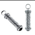 Sterling Silver Black Onyx Twisted Barrel Pendant With Beaded Balinese Caps.