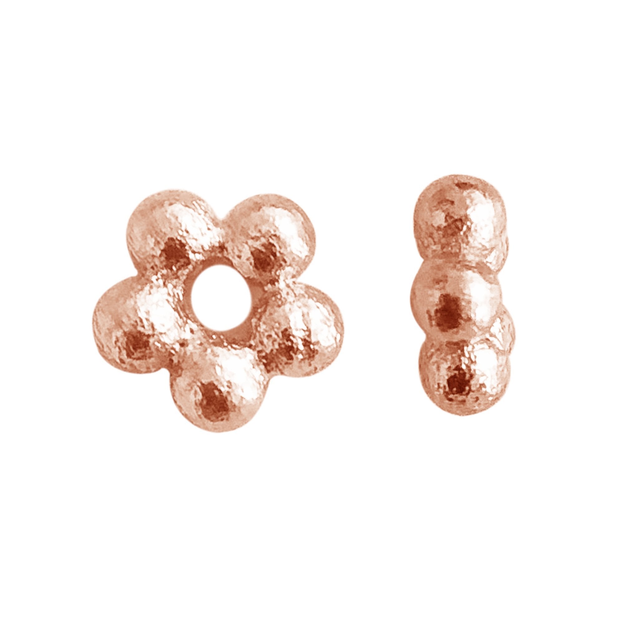 Rose gold overlay over copper flower spacer beads handcrafted in India for jewelry wholesale