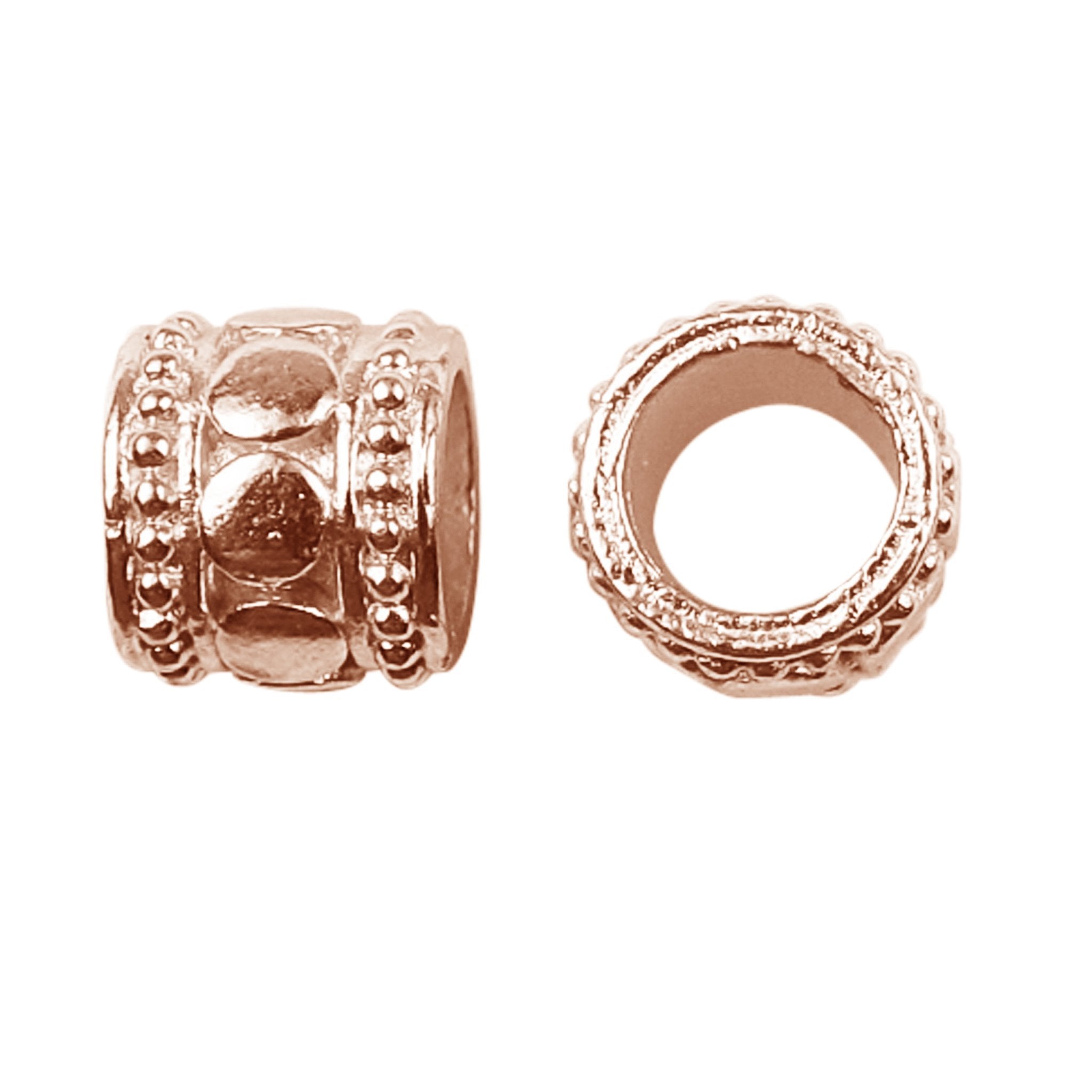 Barrel spacer bead with raised dome accents in rose gold overlay over copper, handcrafted in India