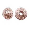 Round spacer bead with spiral scroll motifs in rose gold overlay over copper, handcrafted in India