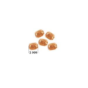 Rose gold overlay over copper washer beads handcrafted in India with Bali-inspired design