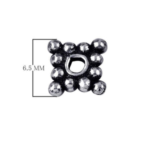 Silver overlay over copper cluster spacer beads handcrafted in India with polished finish and bubble texture.