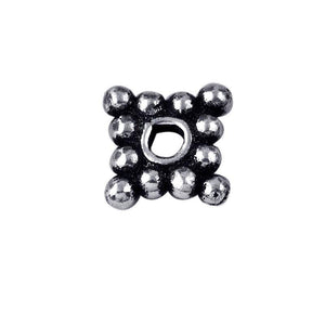 Silver overlay over copper cluster spacer beads handcrafted in India with polished finish and bubble texture.