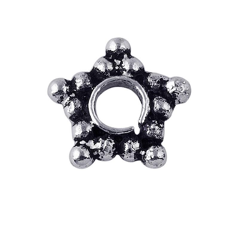Star-shaped granulated spacer bead in silver overlay over copper with oxidized detailing and open circular center.