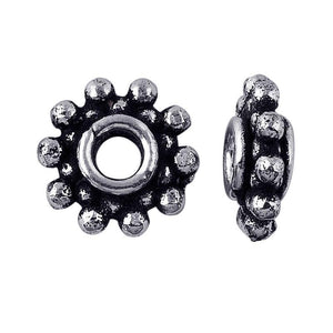 Silver overlay over copper antique floral beaded spacer jewelry component, handcrafted in India, shown in detailed view.