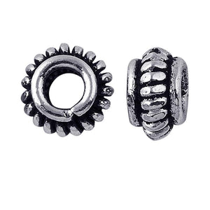 Silver Overlay Over Copper antique gear style beaded spacer jewelry component, handcrafted in India, shown in front and side view.