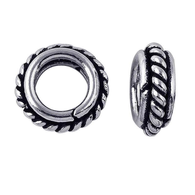 Rope-twist ring spacer bead in silver overlay over copper with oxidized Bali detailing.