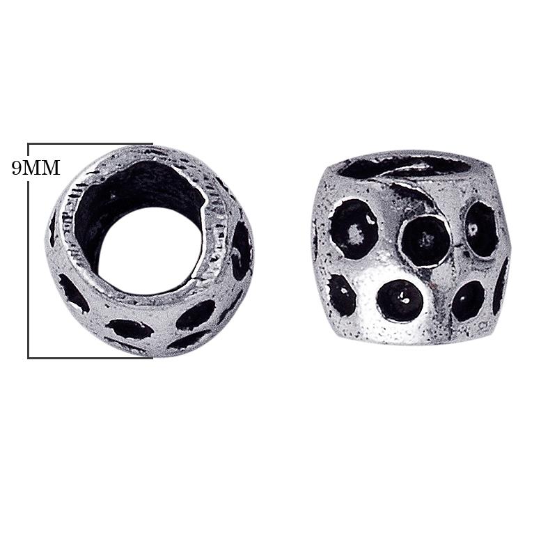 Silver overlay dotted barrel spacer bead with oxidized carved detailing.