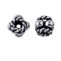 Silver Overlay Over Copper antique interwoven rope knot floral spacer jewelry component, handcrafted in India, shown in front and side view.