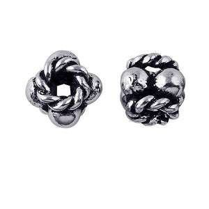 Silver Overlay Over Copper antique interwoven rope knot floral spacer jewelry component, handcrafted in India, shown in front and side view.