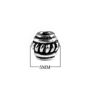 Handcrafted ribbed barrel spacer bead made with Silver Overlay Over Copper, traditional metallic finish, artisan jewelry component from India.