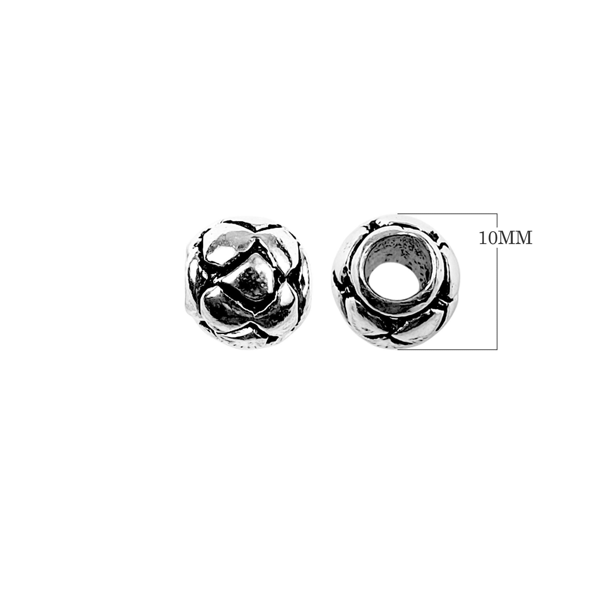 Handcrafted interlaced floral spacer bead made with Silver Overlay Over Copper, rounded decorative design, artisan jewelry component from India.