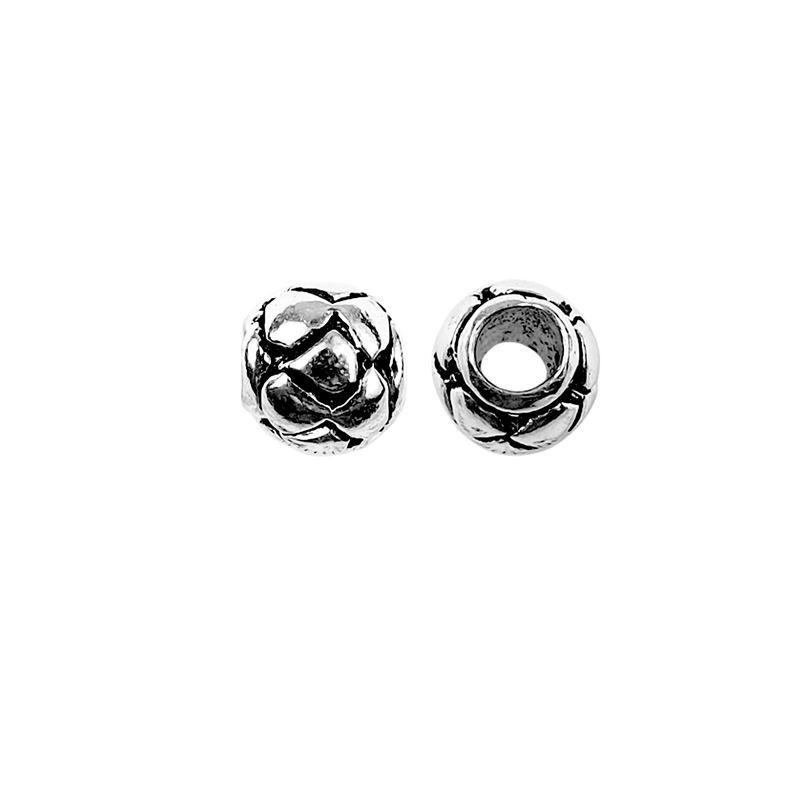 Handcrafted interlaced floral spacer bead made with Silver Overlay Over Copper, rounded decorative design, artisan jewelry component from India.