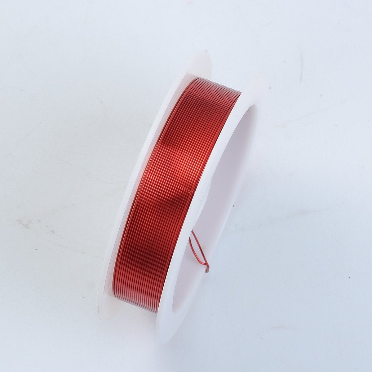 Handcrafted red color silver overlay over copper 28 gauge jewelry wire spool with glossy finish made in India