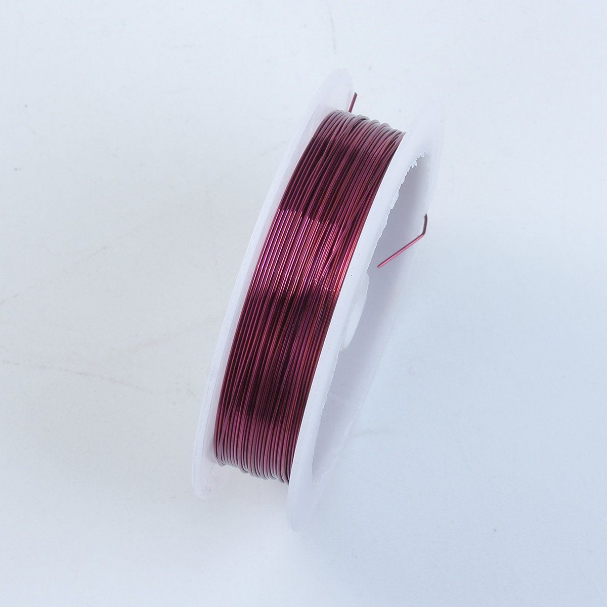 Handcrafted purple silver overlay over copper wire spool for jewelry making from India